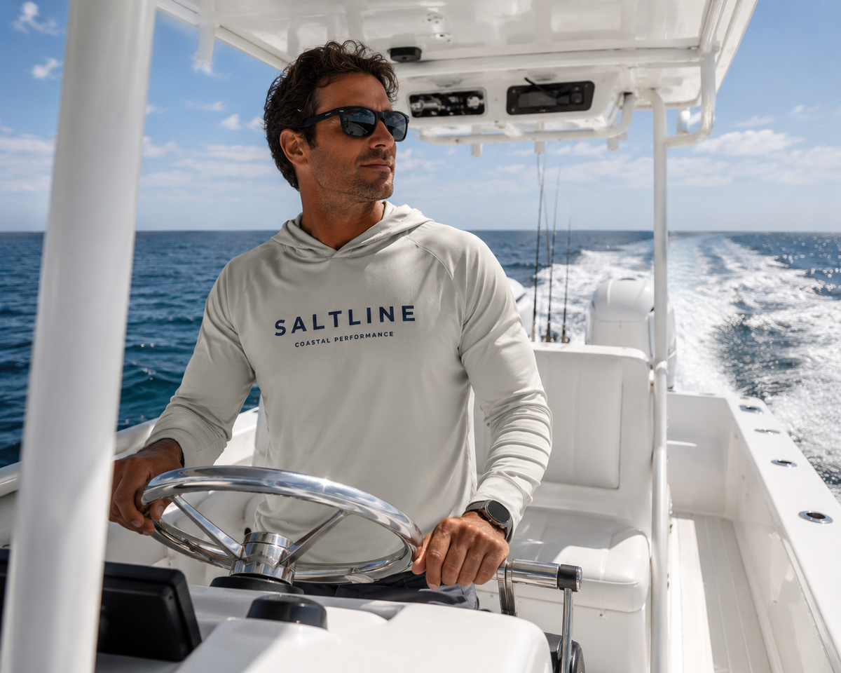 Saltline Driftwood Sand UPF 50+ sun hoodie lifestyle image at the beach