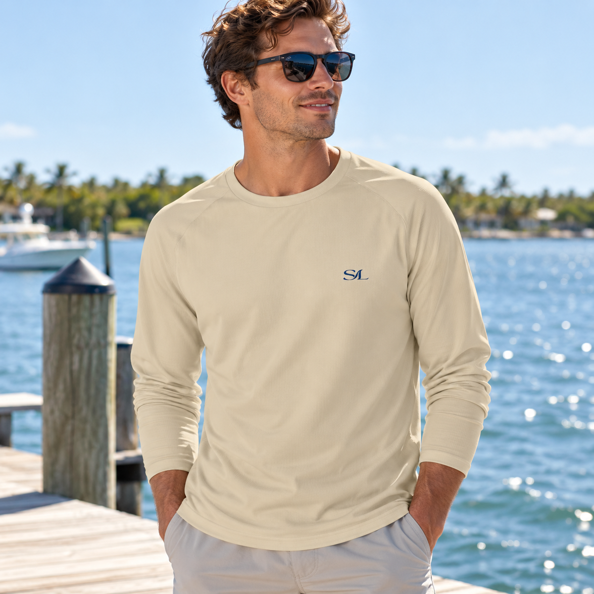Man wearing Driftwood Sand Sun Shirt in a coastal setting