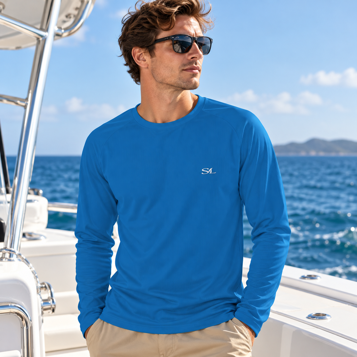 Man wearing Gulf Stream Cobalt Sun Shirt in a coastal setting